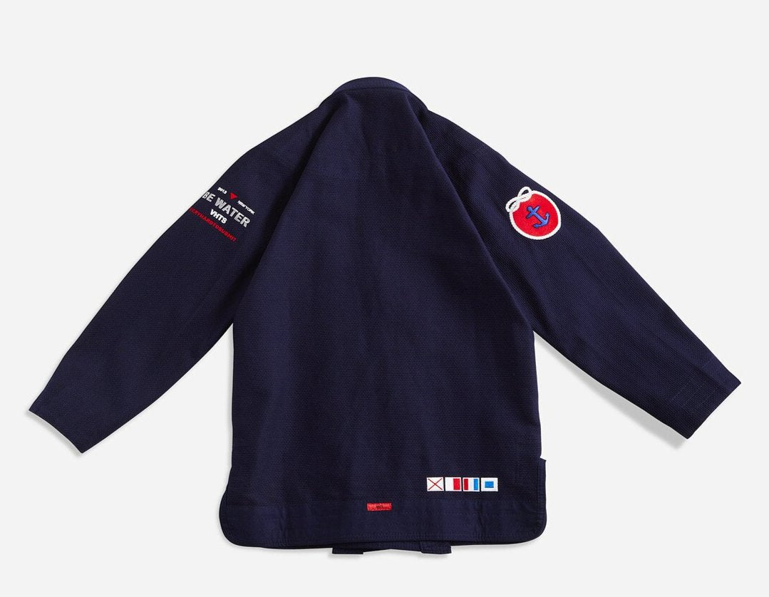 BE WATER 3.0 dark blue THIS IS THIRD DESIGN OF BE WATER KIMONO SERIES NEW DESIGN CAME OUT GREAT MAINTAINING ORIGINAL DESIGN CONCEPT YET INTRODUCING MODERN CUT WITH EDGY AND HIGH QUALITY PATCHES AND LABELS. JACKET: 450 GSM PEARL WEAVE EVA FOAM LAPEL WIDE REINFORCEMENT TAPE ROUND SIDE SLIT FINISH RUBBER LABEL PANTS: 11 OZ COTTON RIP STOP 6 BELT LOOP SYSTEM ROUND DRAW STRING RAISED BACK WIDE REINFORCEMENT TAPE RUBBER LABEL vhts europe
